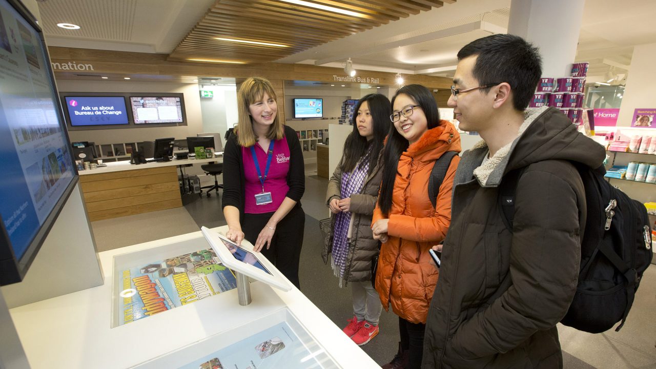 Visit Belfast travel adviser with tourists