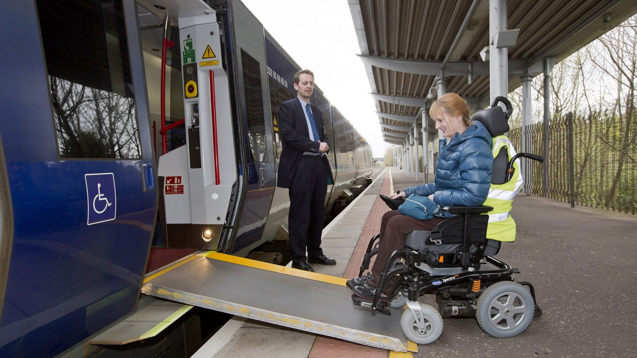 Women in wheelchair using Translink train